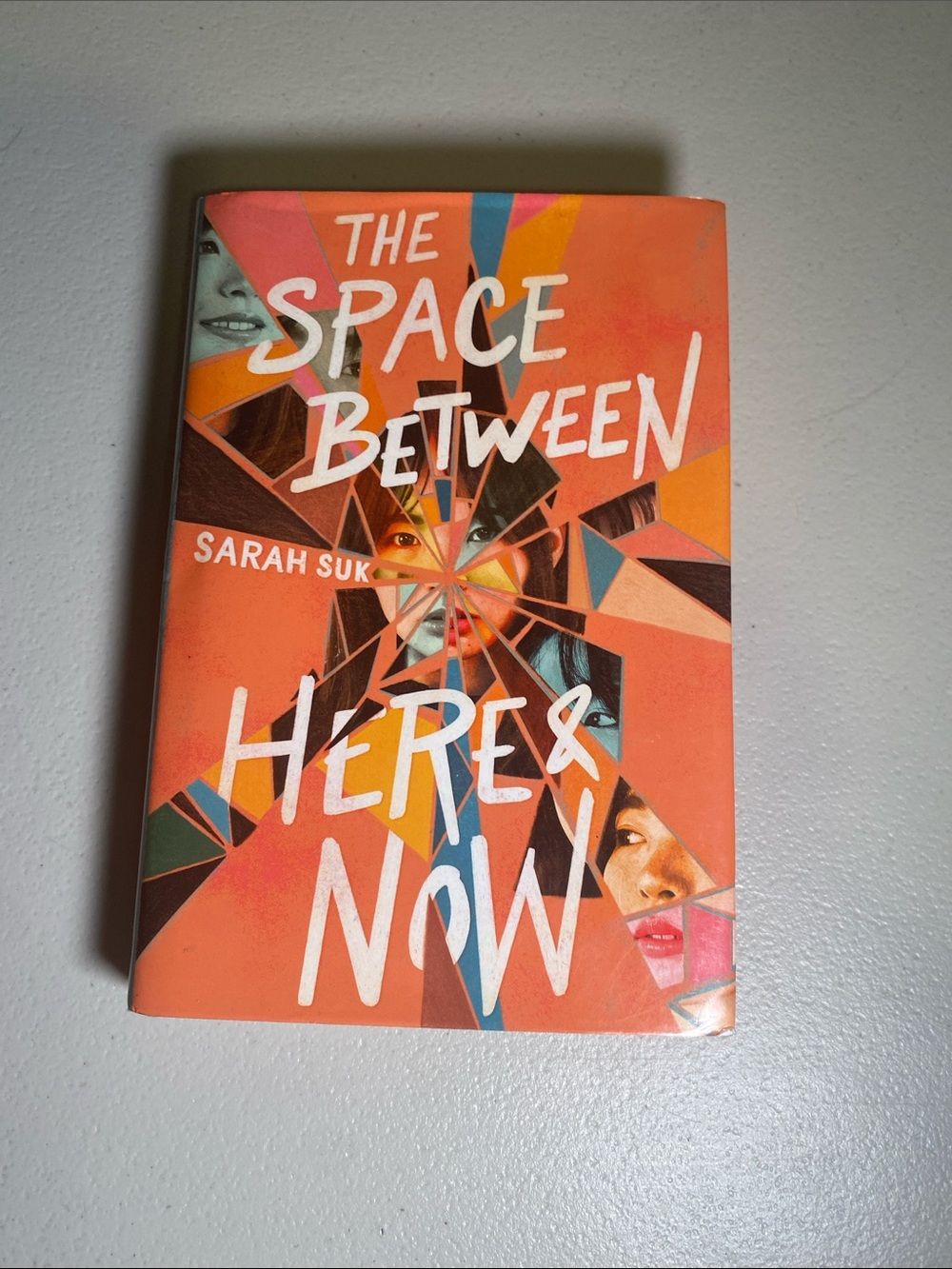 ‘The Space Between Here & Now’ - Orange Paperback Book